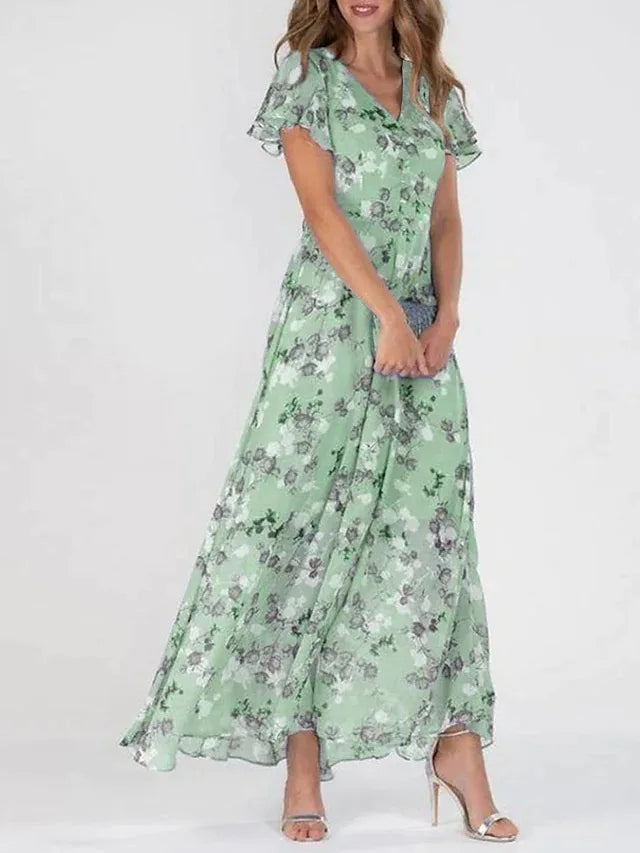 Lilia | Elegant blommig klänning med kort ärm