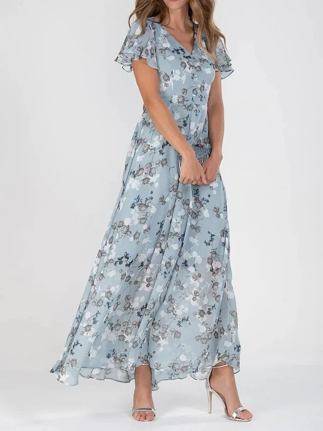 Lilia | Elegant blommig klänning med kort ärm